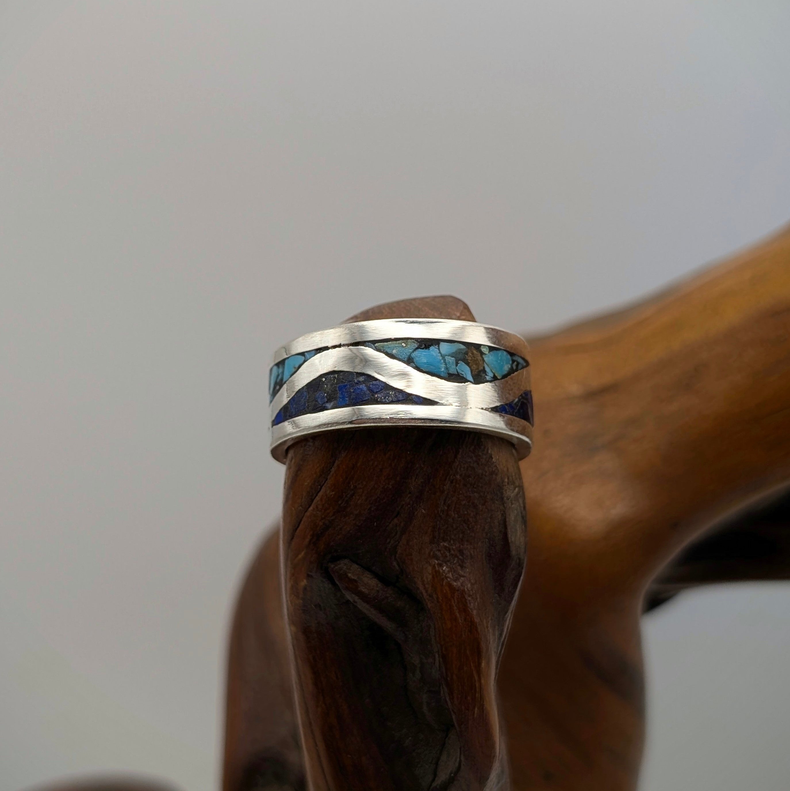 Sterling Silver Ring with Turquoise and Lapis Inlay On Wood Burl River White Background